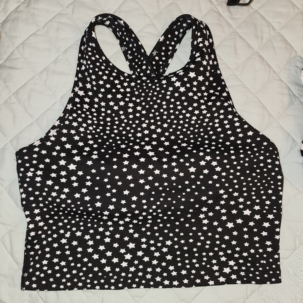 Limited Beyond Yoga studio cropped bra tank in black with stars, like new